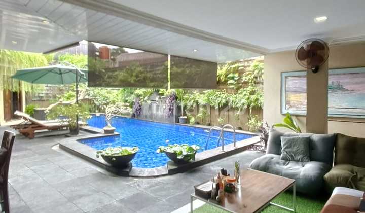 A Serene Balinese-Themed House Complete with a Swimming Pool in Bintaro Jaya