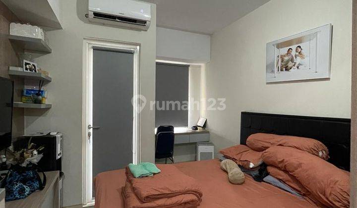 kamar tidur apartemen studio siap huni di