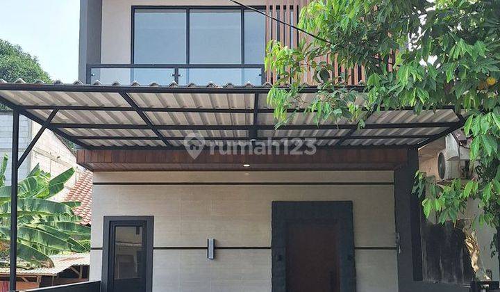 Rumah Jual Gaya Modern Tropis 2 Lantai Siap Huni 1