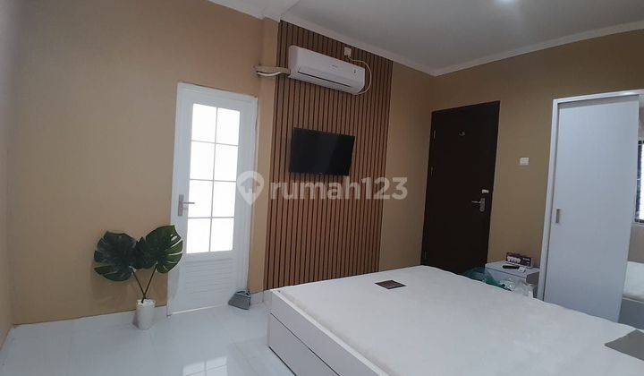 RUMAH CANTIK 2 LANTAI FULL FURNISHED SIAP HUNI DI CLUSTER GRAHA RAYA  2