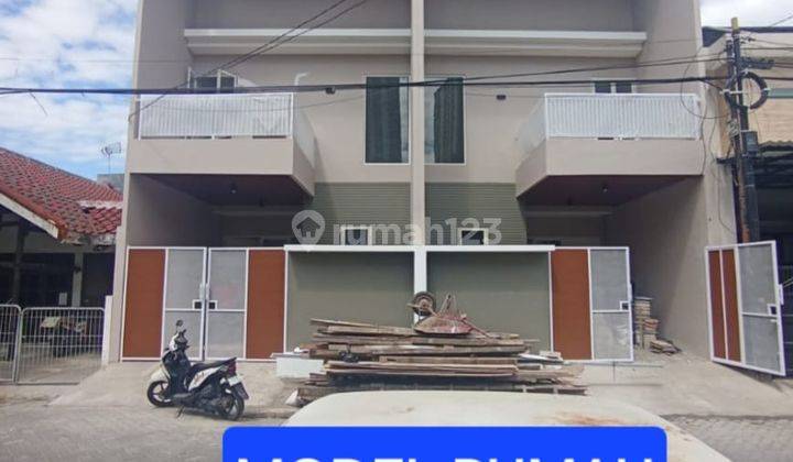 Rumah Baru di Babatan Pilang Lokasi depan dekat Jalan Raya (code : DND) 1