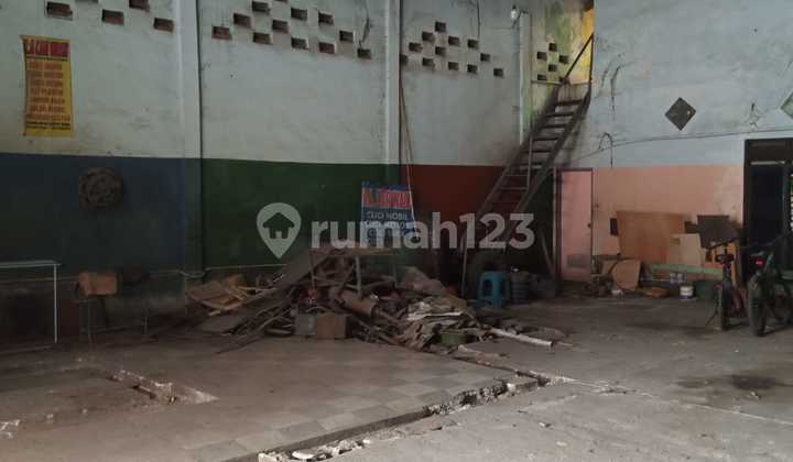 Warehouse and Residence Combined on the Side of a Main Highway