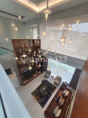 Luxury Sale: 3.5 Beautifully Furnished House in Puri Mansion Housing Complex with 4 Bedroom Access, Swimming Pool, Large Carport near Puri Indah Mall, Lippo Mall Puri, West Jakarta Mayor's Office, and Toll Gate Entrance