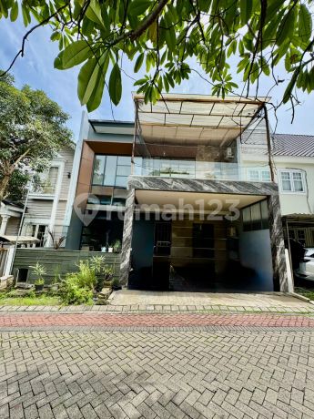 For Sale: 2-Story Alam Hijau House with Mezzanine, High Ceiling, Citraland, Ready to Live, Minimalist, Close to Modern Market and Pakuwon Mall, West Surabaya.