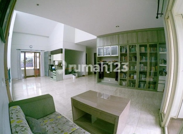 A Comfortable, Green, and Quiet Home in Front of a Park, Ready to Occupy in Alamanda Dago Permai