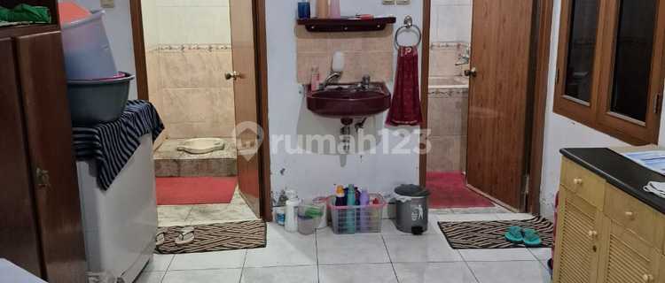 well-maintained house inside the Holis Indah 2 garden complex cluster 1