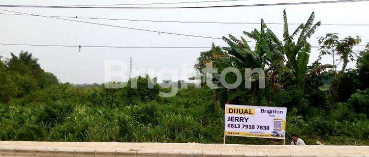 TANAH LUAS DI PINGGIR JALAN LOKASI STRATEGIS DI KARYA JAYA 1