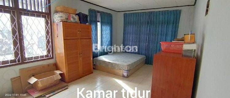 TANAH PINGGIR JALAN RAYA BONUS RUMAH 1