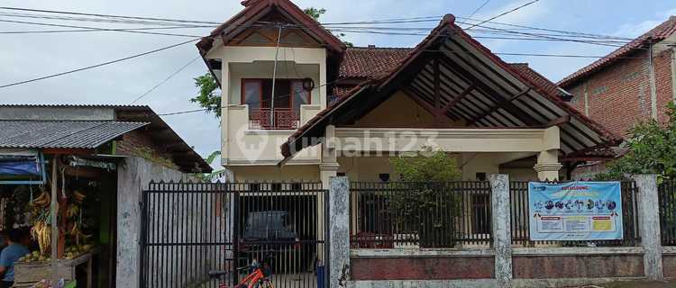 Main Road and Well-Maintained House 1