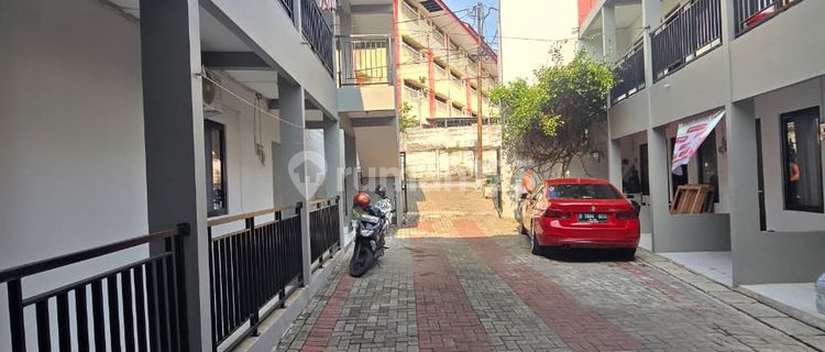 For Sale: Boarding House and 3 Rented Shops Fully Occupied Near Campus in Depok 1