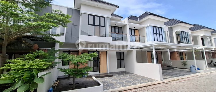 RUMAH MINIMALIS TROPIS PERUMAHAN PRESTISIUS JALIMBAR DEKAT KAMPUS 1