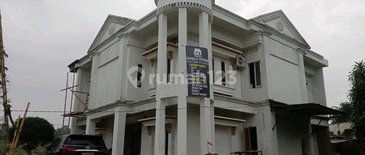 New Boarding House with 30 Rooms in a Highly Strategic Location. Directly Opposite a Factory with 1500 Employees. Potential Monthly Income When Fully Occupied (30 Rooms) = Rp. 24 Million/Month. Bustling Area Open 24 Hours. 1 Km to Parung Kuda Toll Gate. Certificate of Ownership (SHM). 1